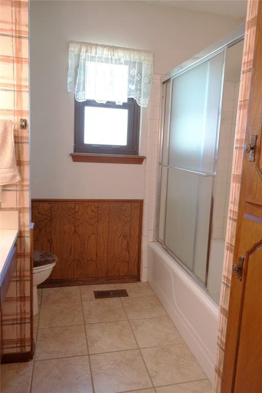 5624 N Mueller Ave, Bethany, OK 73008 - full bathroom featuring vanity, bath / shower combo with glass door, and tile patterned flooring