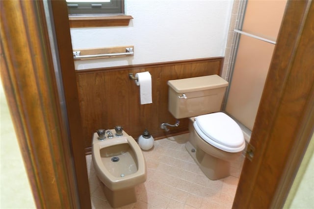 5624 N Mueller Ave, Bethany, OK 73008 - bathroom with a bidet, a wainscoted wall, tile patterned flooring, an enclosed shower, and wooden walls