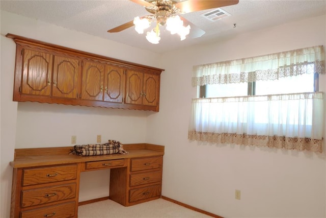 5624 N Mueller Ave, Bethany, OK 73008 - office area featuring a ceiling fan, built in desk, and light carpet