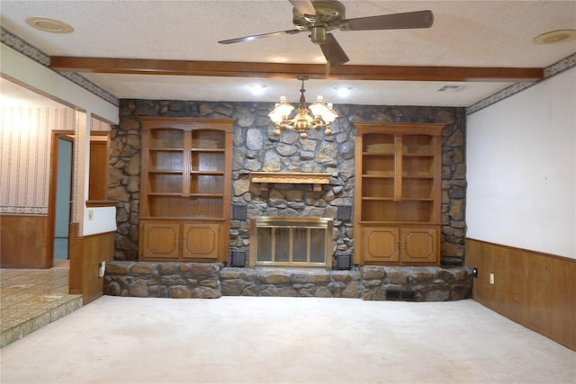 5624 N Mueller Ave, Bethany, OK 73008 - unfurnished living room with carpet floors, beamed ceiling, wainscoting, a textured ceiling, and wood walls