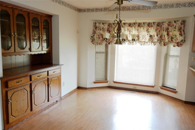 5624 N Mueller Ave, Bethany, OK 73008 - unfurnished dining area featuring light wood-style floors and a ceiling fan