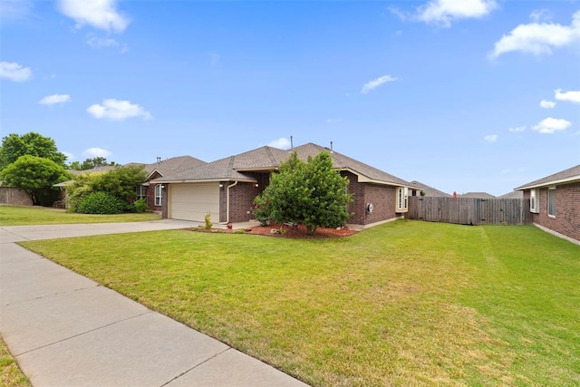 4125 Queens Dr, Moore, OK 73160 - view of front of house featuring concrete driveway, brick siding, and an attached garage