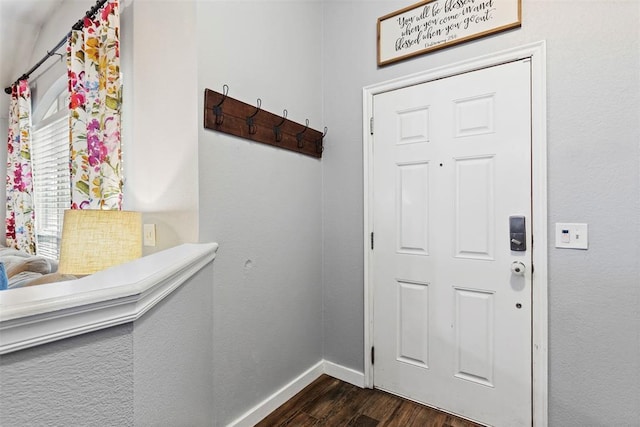 4125 Queens Dr, Moore, OK 73160 - entryway featuring dark wood-style floors and baseboards