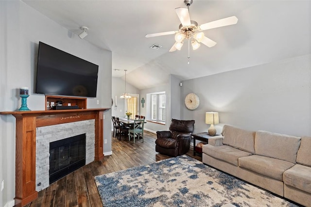 4125 Queens Dr, Moore, OK 73160 - living area featuring lofted ceiling, wood finished floors, a ceiling fan, baseboards, and a chandelier