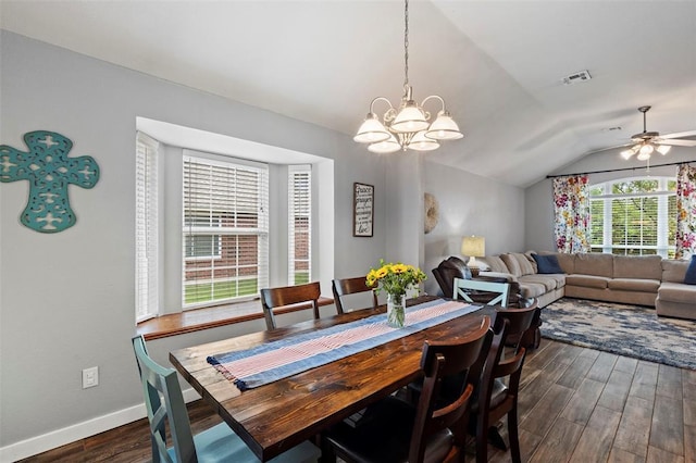 4125 Queens Dr, Moore, OK 73160 - dining area featuring dark wood finished floors, lofted ceiling, a chandelier, a ceiling fan, and baseboards