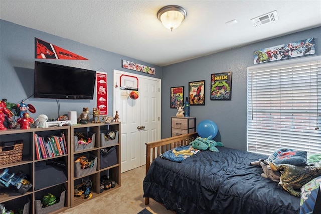 4125 Queens Dr, Moore, OK 73160 - bedroom with carpet flooring and a textured wall