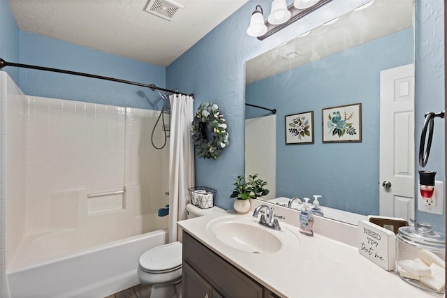 4125 Queens Dr, Moore, OK 73160 - bathroom with a textured wall, shower / bath combo with shower curtain, toilet, and vanity