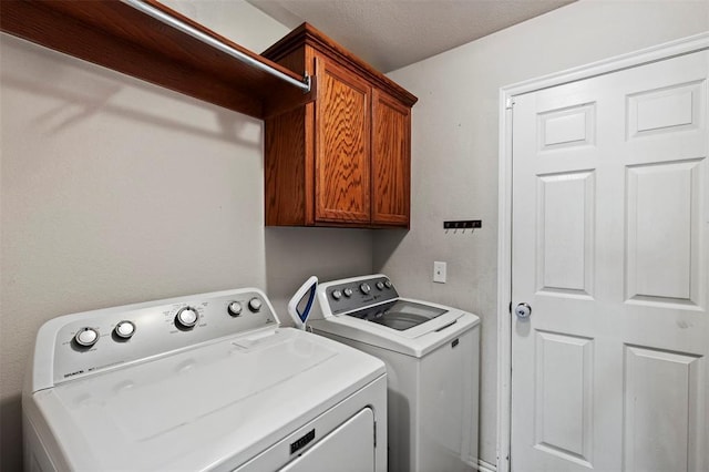 4125 Queens Dr, Moore, OK 73160 - laundry room with washer and clothes dryer and cabinet space