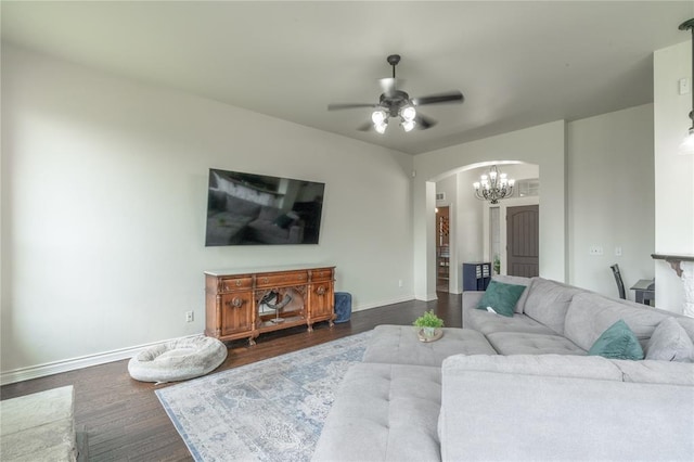 2504 NW 180th St, Edmond, OK 73012 - living area featuring arched walkways, baseboards, a ceiling fan, dark wood-style flooring, and a chandelier