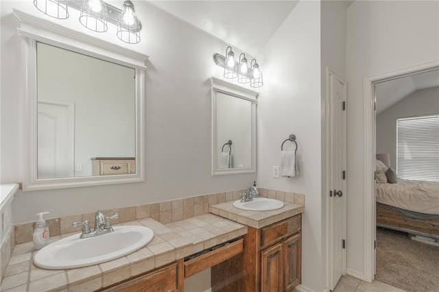 2504 NW 180th St, Edmond, OK 73012 - full bathroom with lofted ceiling, ensuite bathroom, and double vanity