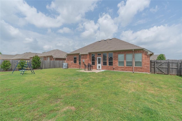 2504 NW 180th St, Edmond, OK 73012 - rear view of house with brick siding, a patio area, and a shingled roof