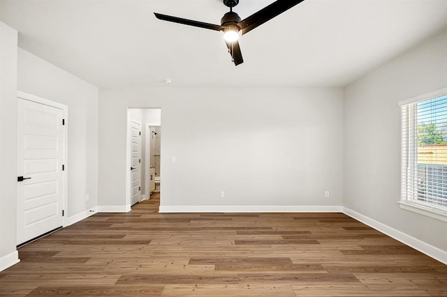 11904 SW 30th St, Yukon, OK 73099 - empty room featuring baseboards, a ceiling fan, and wood finished floors