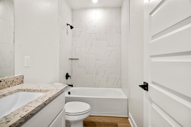 11904 SW 30th St, Yukon, OK 73099 - bathroom with wood finished floors, vanity, tub / shower combination, and toilet