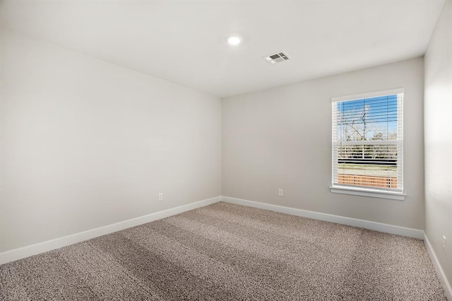 11904 SW 30th St, Yukon, OK 73099 - spare room with baseboards, light colored carpet, and recessed lighting