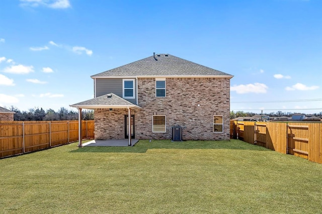 11904 SW 30th St, Yukon, OK 73099 - back of house with a patio area, a shingled roof, brick siding, and central AC unit