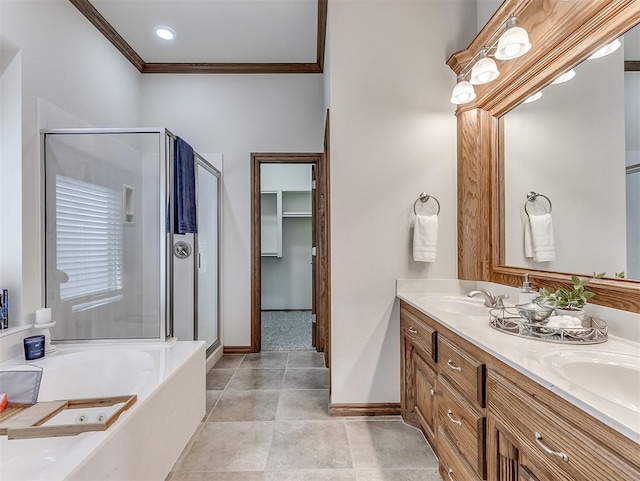 1017 SW 107th St, Oklahoma City, OK 73170 - full bathroom featuring a stall shower, baseboards, ornamental molding, a garden tub, and double vanity