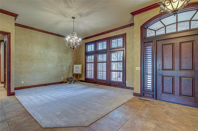 12509 St Lukes Ln, Oklahoma City, OK 73142 - entrance foyer with a chandelier, ornamental molding, tile patterned floors, baseboards, and a textured wall