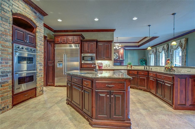 12509 St Lukes Ln, Oklahoma City, OK 73142 - kitchen with built in appliances, crown molding, a sink, a center island with sink, and light tile patterned flooring
