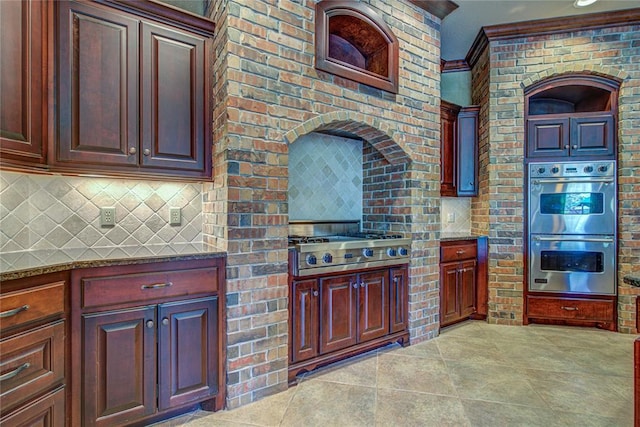 12509 St Lukes Ln, Oklahoma City, OK 73142 - kitchen with stainless steel appliances, backsplash, and dark stone counters
