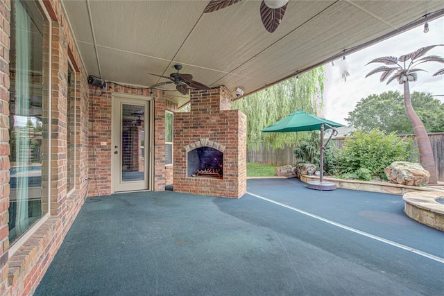 12509 St Lukes Ln, Oklahoma City, OK 73142 - view of patio featuring an outdoor brick fireplace and a ceiling fan