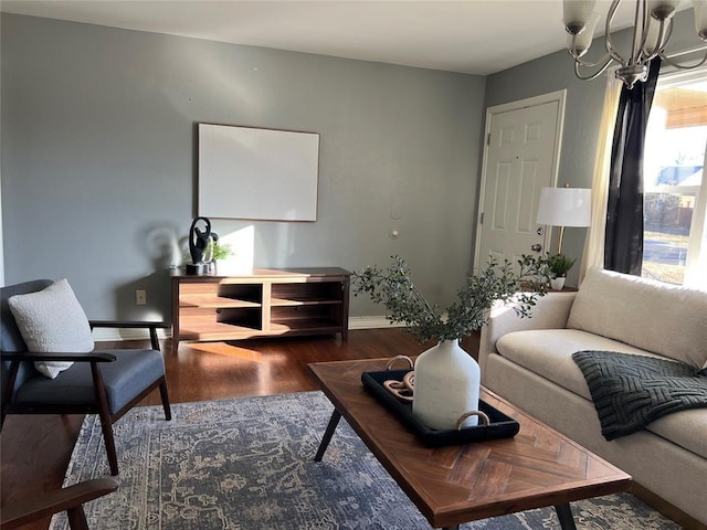 2109 Brighton Ave, Oklahoma City, OK 73120 - living area featuring wood finished floors, baseboards, and a chandelier