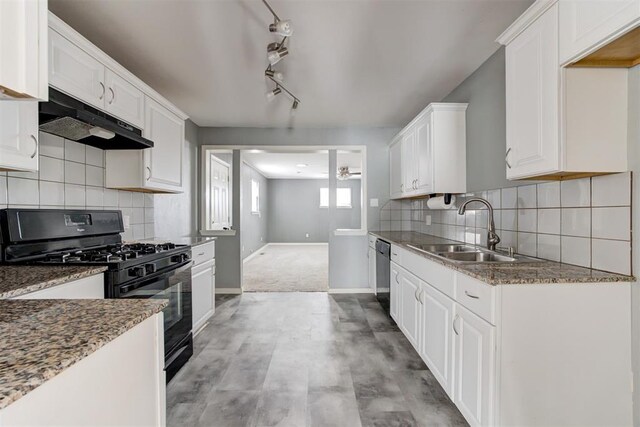2109 Brighton Ave, Oklahoma City, OK 73120 - kitchen featuring under cabinet range hood, black gas range, dishwashing machine, ceiling fan, and a sink