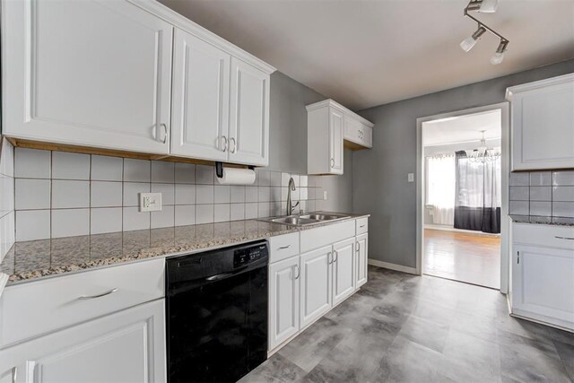 2109 Brighton Ave, Oklahoma City, OK 73120 - kitchen with dishwasher, a sink, white cabinets, light stone counters, and backsplash