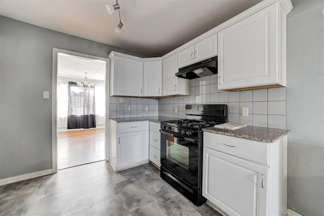 2109 Brighton Ave, Oklahoma City, OK 73120 - kitchen with black gas range, under cabinet range hood, a chandelier, backsplash, and white cabinets