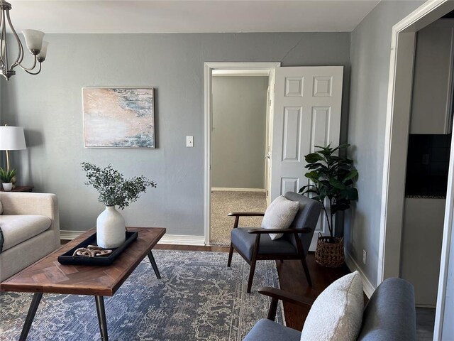 2109 Brighton Ave, Oklahoma City, OK 73120 - living area featuring a chandelier, baseboards, and dark wood finished floors