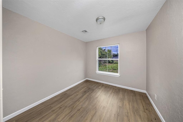 3134 NW Ferris Ave, Lawton, OK 73505 - spare room featuring wood finished floors and baseboards