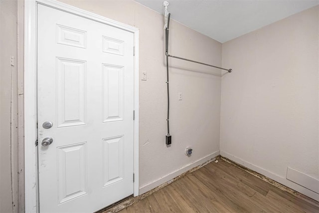 3134 NW Ferris Ave, Lawton, OK 73505 - laundry room with light wood-style flooring and baseboards