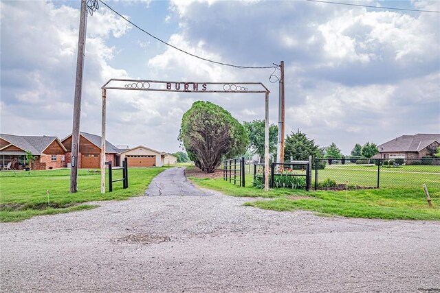 8100 N Burns Rd, Edmond, OK 73025 - view of dirt / gravel driveway featuring a gated entry
