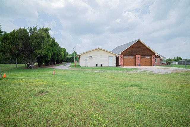 8100 N Burns Rd, Edmond, OK 73025 - view of property exterior with a garage, a yard, and brick siding