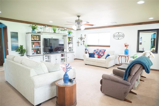 8100 N Burns Rd, Edmond, OK 73025 - living room with ceiling fan, light carpet, crown molding, arched walkways, and recessed lighting