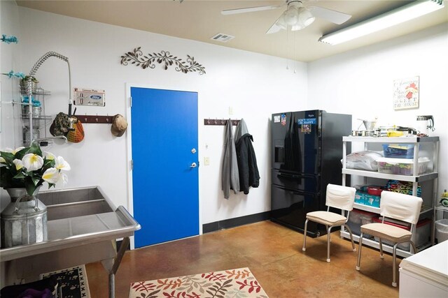 8100 N Burns Rd, Edmond, OK 73025 - miscellaneous room with concrete flooring and ceiling fan