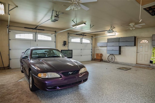8100 N Burns Rd, Edmond, OK 73025 - garage featuring a ceiling fan and a garage door opener