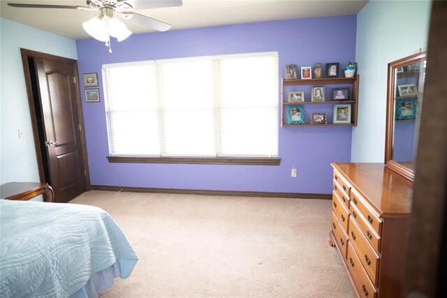 8100 N Burns Rd, Edmond, OK 73025 - bedroom featuring light carpet, baseboards, and ceiling fan