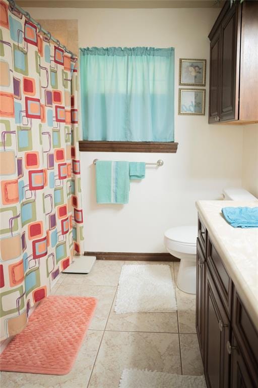 8100 N Burns Rd, Edmond, OK 73025 - bathroom featuring vanity, toilet, curtained shower, and tile patterned flooring