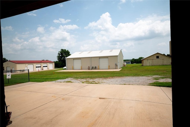 8100 N Burns Rd, Edmond, OK 73025 - view of patio featuring a garage and an outbuilding