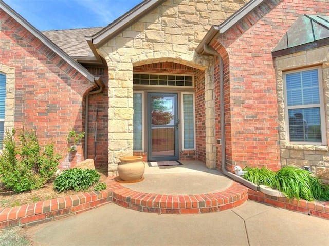 5877 W Washington Ave, Piedmont, OK 73078 - entrance to property with brick siding, stone siding, and a shingled roof