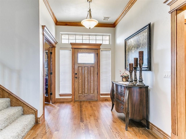 5877 W Washington Ave, Piedmont, OK 73078 - entryway featuring ornamental molding, wood finished floors, stairway, and baseboards