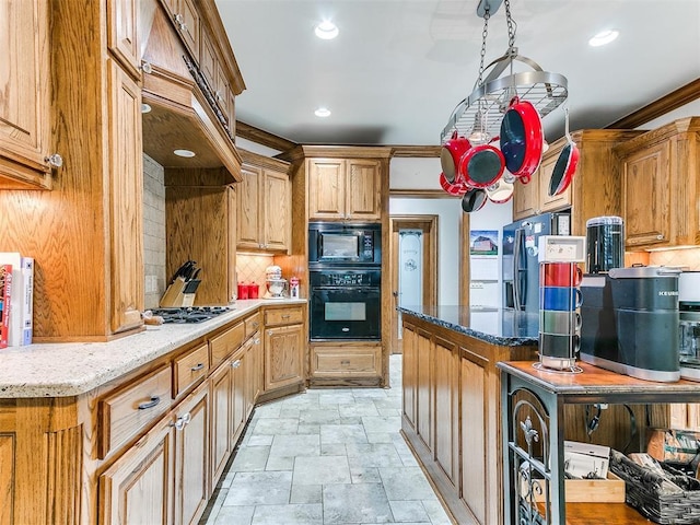 5877 W Washington Ave, Piedmont, OK 73078 - kitchen featuring black appliances, backsplash, stone finish floors, light stone counters, and recessed lighting
