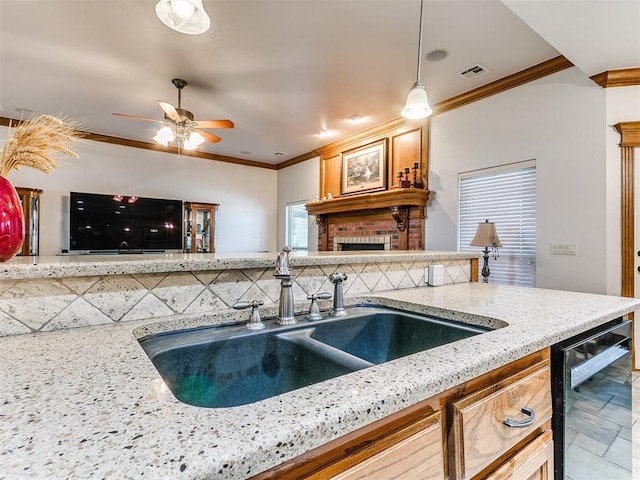 5877 W Washington Ave, Piedmont, OK 73078 - kitchen featuring a sink, a fireplace, ornamental molding, dishwasher, and tasteful backsplash