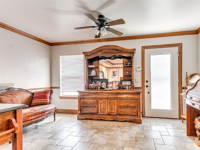 5877 W Washington Ave, Piedmont, OK 73078 - living area featuring a ceiling fan, baseboards, light stone finish floors, and crown molding