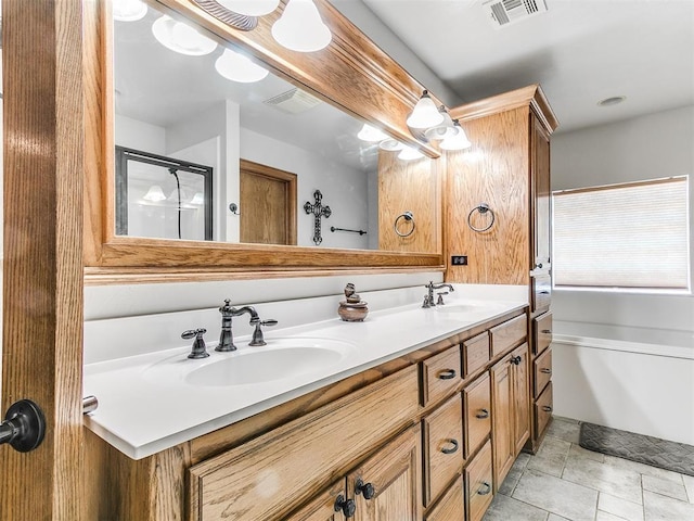 5877 W Washington Ave, Piedmont, OK 73078 - bathroom with double vanity, stone finish flooring, a shower with shower door, and a tub