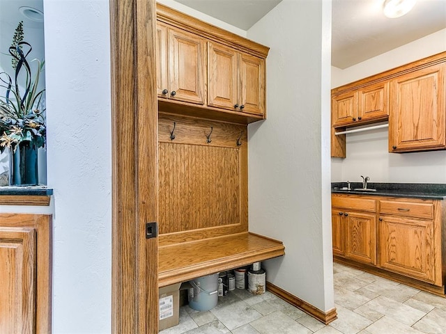 5877 W Washington Ave, Piedmont, OK 73078 - mudroom featuring a sink and baseboards