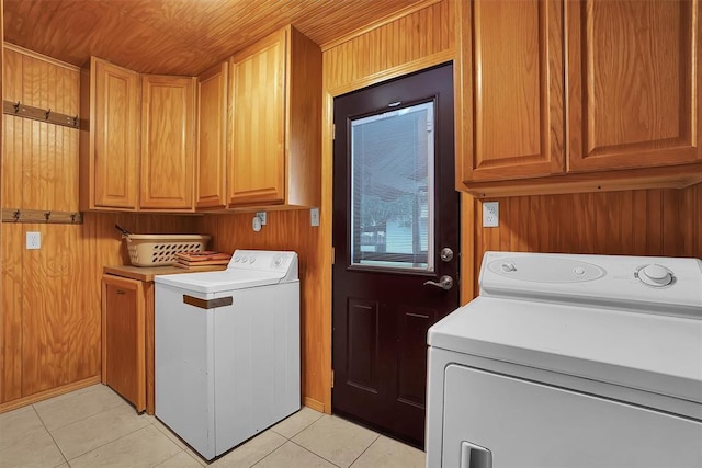 20523 E County Road 158th Rd, Altus, OK 73521 - laundry room featuring cabinet space, light tile patterned floors, washer and dryer, and wood walls