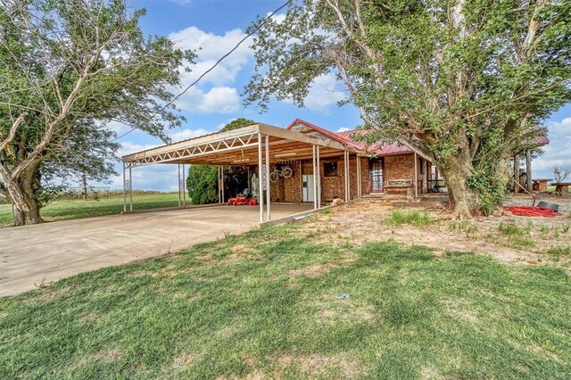 20523 E County Road 158th Rd, Altus, OK 73521 - view of grassy yard with concrete driveway and a carport