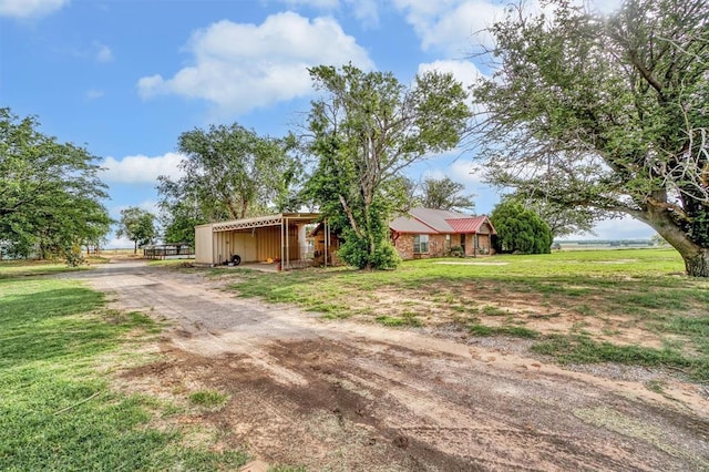 20523 E County Road 158th Rd, Altus, OK 73521 - view of front facade featuring driveway, a front yard, and board and batten siding
