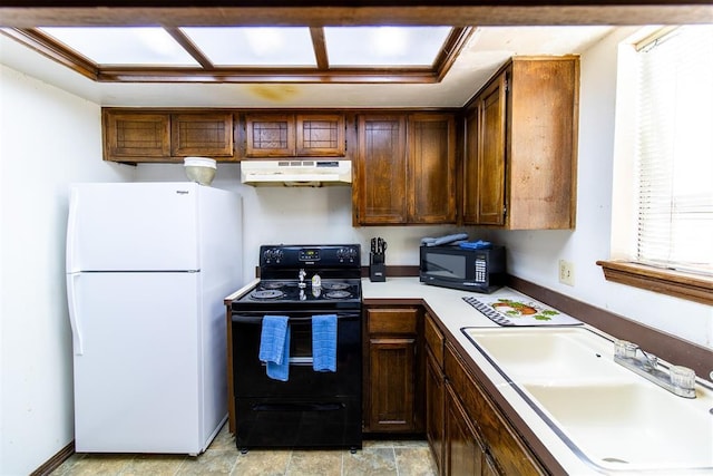 823 Two Forty Pl, Oklahoma City, OK 73139 - kitchen featuring black appliances, under cabinet range hood, a sink, and light countertops
